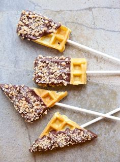 four pieces of chocolate covered waffle pops