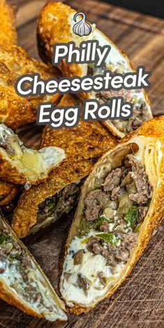 an egg roll cut in half on a cutting board with text overlay reading phily cheesesteak egg rolls