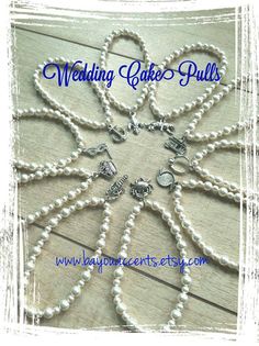 the wedding cake pull is made with pearls and silver beads, which are attached to a chain