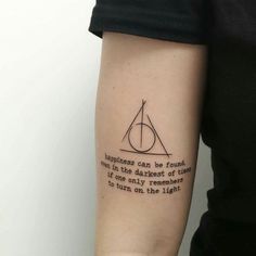 a person with a harry potter tattoo on their arm