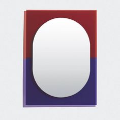 a square shaped mirror with red, purple and blue colors on the bottom half in front of a white background