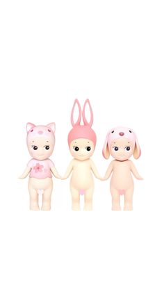 three small toy animals standing next to each other