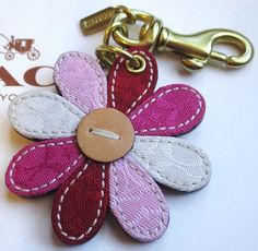 a close up of a flower shaped key chain