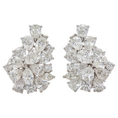 Finely crafted in platinum with Pear-Shaped, Round and Marquise cut Diamonds weighing a total of 14.28 carats, G-H color, VS1-VS2 clarity. Circa 1950s 1 inch length Luxury Diamond-shaped Diamond Earrings, Luxury Vintage Rose Cut Diamond Earrings, Designer Diamond Earrings, 1950s Jewelry, Diamond Earring, Marquise Cut Diamond, Autumn 2024, Pear Shaped Diamond, Gorgeous Jewelry