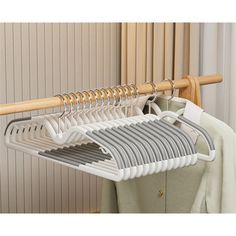 an over the door rack with clothes hanging from it's sides and two hangers on each side