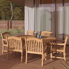 a wooden table and chairs on a deck