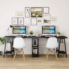 two white chairs sitting in front of a computer desk with pictures on the wall above it