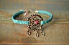 a bracelet that has a dream catcher on it