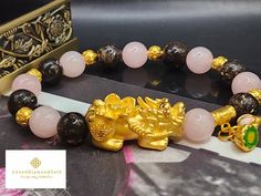 Gift yourself or your love once this 24 Karat Gold Lucky  Pi Xiu Bracelet.  *Materials: 24 Karat Gold, Rose Quartz, Phlogopite *Karat: 24k Au999 *Gold Color: Yellow *Weight: Approx. 30g *Length: 6 Inches to 8 Inches *Gold Mass: Approximately 5.55g *Stone Size: Approx.  10.3mm Real 24K Gold. NOT gold filled. Not gold Plated. Hallmarked 🧧The meteological creature Pixiu, Bixie or Tianlu is believed to guard and accumulate wealth.  If your having bad luck financially or you want to guard your wealth, then Pixiu is the perfect choice for you. 💥PLS FOLLOW US AND CHECK OUR OTHER LISTINGS. WE HAVE NEW STOCKS LISTED DAILY/WEEKLY.  📬S H I P P I N G WE SHIP WITHIN 24 HOURS. Free shipping in the US and International orders. Gold Bracelets With Round Beads For Good Luck, Gold Beaded Good Luck Bracelets, Gold Spiritual Bracelets As Gifts, Traditional Gold Bracelet, Gold Crystal Bracelet For Valentine's Day Gift, Traditional Gold Bracelets As Gifts, Gold Spiritual Crystal Bracelet For Gift, Gold Money, Ball Bracelet