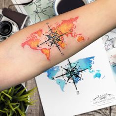 a person with a tattoo on their arm and the world map behind them is shown