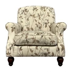 an upholstered chair with flowers and leaves on it