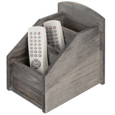 two remote controls in a wooden holder