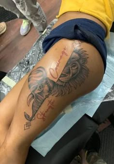 an elephant tattoo on the leg of a woman