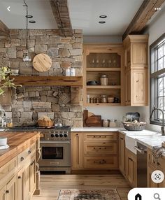 a kitchen with stone walls and wooden cabinets is shown in this image, there is a rug on the floor next to the stove