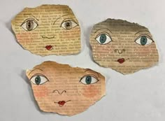 three pieces of paper that have been cut out to look like children's faces