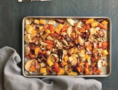 a pan filled with cooked vegetables on top of a table