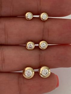 14K Yellow Gold Bezel Stud Earrings | Solitaire Earrings | Cubic Zirconia Studs | Dainty Bezel Studs | 5MM, 6MM, 7MM Shiny Everyday Earrings | Bezel Set Diamond Alike Earrings Studs | 14k Gold Earrings | 14K Gold Bezel Studs♦ Materials: 14K Gold♦ Available colors: Yellow Gold ♦ Closure: Push Back♦ Earrings Measurements: 5 MM, 6MM and 8MM. PLEASE REFER TO THE ACTUAL DIMENSIONS. WE HAVE ENLARGED THE PICTURES FOR A BETTER VIEW-------------------------------------------------- ♦ -------------------- Blink Blink, Solitaire Earrings, Gold Ring Designs, Tragus Earrings, Marvel Entertainment, Gold Bracelet For Women, Classic Earrings, Beaded Collar, Bezel Set Diamond