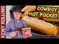 a man holding a box of cowboy hot pockets in front of a large frying pan