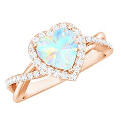 a rose gold ring with an opal and diamonds