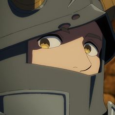 a close up of a person wearing a helmet and looking at something with eyes wide open