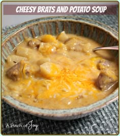 a bowl filled with cheese and potato soup