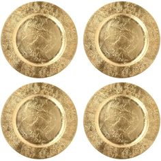 four gold plates with designs on them