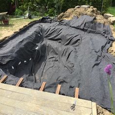 an outdoor pool is being built in the sand