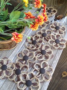 several pieces of jute and rope with flowers in the background