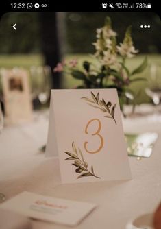 the table numbers are displayed on cards and place settings for guests to sit down at