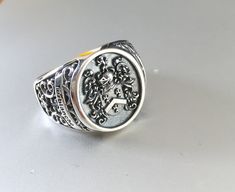 Custom made and cast silver family crest signet rings. We custom make each ring to suit the clients needs. We can either do a traditional round or a more modern square design. 3D cad designs are sent to the client to approve before the ring is meticulously cast. Clients have a choice whether to include elements such as vintage filigree detailing on the side, the last name on the face of the ring or on the side, black detailing or polished finish. Production time including the design phase can ta Family Crest Ring, Mens Signet Ring, Black Titanium Ring, Family Crest Rings, Etiquette And Manners, Cad Design, Modern Square, Titanium Rings, Family Crest