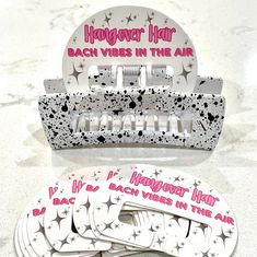 Looking for the perfect bachelorette party favor? Look no further than these stylish and trendy hair clips! Comes with a display card that adds a special touch! Whether worn during your bachelorette party or taken home as a keepsake, this hair clip is a must-have party favor that your bridesmaids will love!  Clips measure 4 inches long. Choose from white speckled, black speckled or pink.  The pink clip is two-toned (one side is pink, the other side is clear). The colors of our hair clips are pictured as closely as possible. However, there may be minor variations because computer settings vary. Bridesmaid Claw Clip, Affordable Teacher Gifts, Trendy Hair Clips, Pink Clip, Bridesmaid Hair Clips, Clear Gift Bags, Wedding Barrettes, Bachelorette Party Favor, Hair Clips For Women