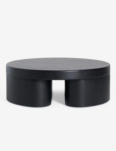 a black coffee table with two circular bases