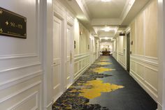 the hallway is clean and ready for guests to use it as an office building or hotel