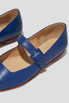 The Eugenia Flat is a modern interpretation of the classic mary jane flat featuring a square toe, angular topline and oval-shaped heel. This pair is crafted from vibrant blue kidskin leather and a matching buckle. Who it’s for: The woman who is looking for mood-enhancing emotional pieces that defy reason, yet work perfectly with her style and sense of expression. Kidskin upper and undyed vegetable-tanned leather lining. Leather sole with stacked leather heel measuring 18mm. Handmade in Argentina