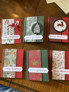 four christmas cards are laid out on a table with paper and ribbon attached to them