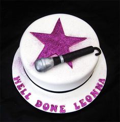 there is a cake with a microphone on it and the words hell donee lowdown