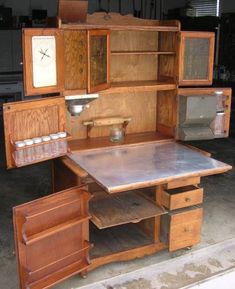 an old fashioned desk with drawers and cupboards