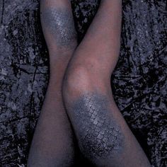 the legs and ankles of a woman with black skin