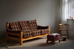 a living room with a plaid couch and chair