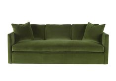 a green velvet couch with pillows on the top and bottom, in front of a white background