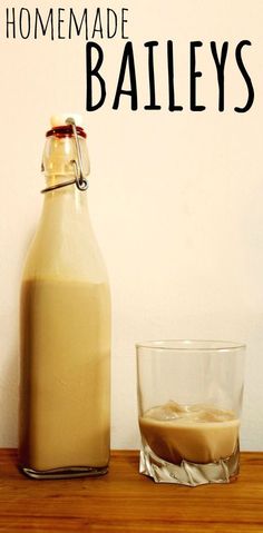 homemade bailey's drink sitting on a table next to a glass with liquid in it