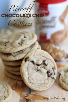 chocolate chip cookies stacked on top of each other next to a jar of peanut butter