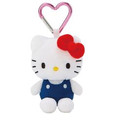 a hello kitty keychain with a red bow on it's head and blue overalls