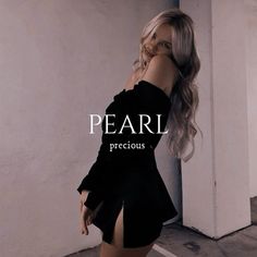 a woman in a black dress leaning against a wall with the words pearl precious precious