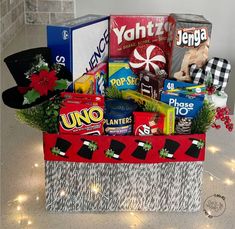 a christmas gift basket filled with candy and snacks