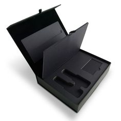 an open black box with two pieces of paper in the bottom and one piece missing