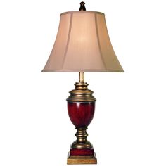 a red lamp with a white shade on it