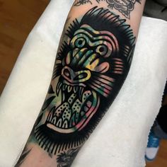 a man's arm with an animal tattoo on it