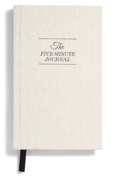 the five - minute journal is shown in black and white, with an inscription on it