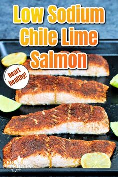 grilled salmon on a grill with limes and lemon wedges in the background